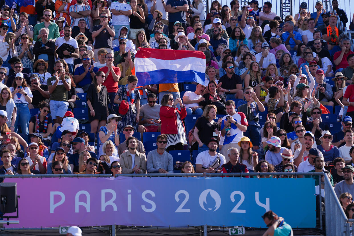 PARIS, FRANCE - JULY 28: Supporters of the Netherlands with flag in the Men's Preliminary Phase during Day 2 of Beach Volleybal - Olympic Games Paris 2024 at Eiffel Tower Stadium on July 28, 2024 in Paris, France. (Photo by Joris Verwijst/BSR Agency/Getty Images)