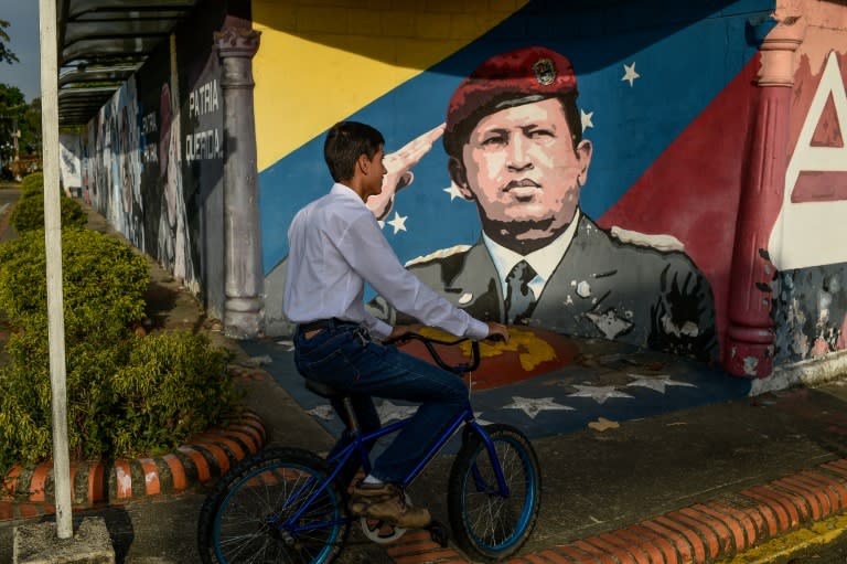 The former leader's image is emblazoned all over town, 20 years after he launched the Venezuelan revolution