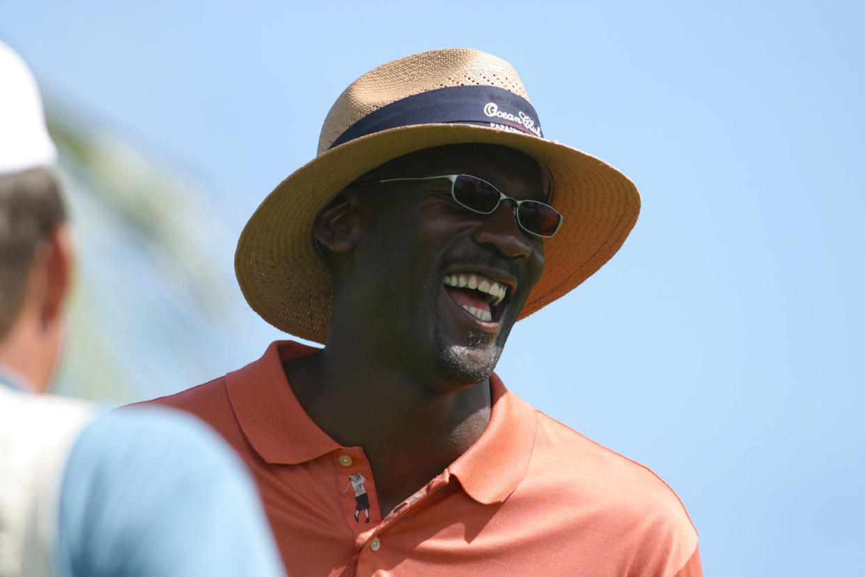 Michael Jordan enjoys a laugh during his Celebrity Invitational at the Ocean Club Golf Course on Sunday, Sept. 22, 2002 at the Ocean Club resort on Paradise Island in the Bahamas. The tournament hopes to raise $500,000 matching the amount reached at the inaugural event last year, with the funds going to the Ronald McDonald Houses of North Carolina and a local Bahamian charity. (AP Photo/Tim Aylen)