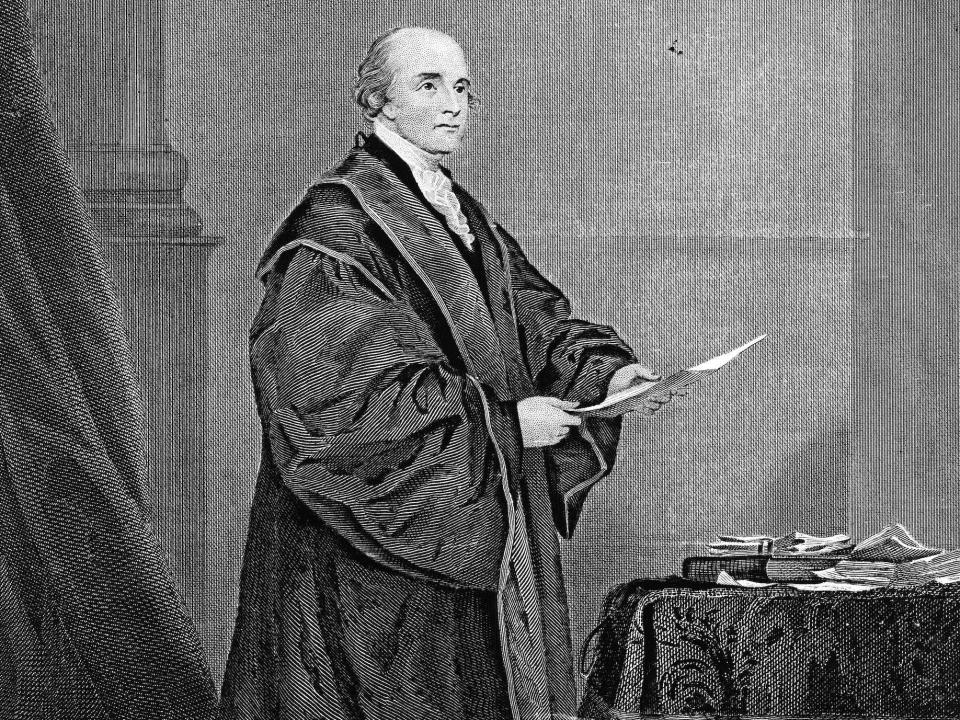 An engraved portrait of American politician, governor, and first Chief Justice of the Supreme Court John Jay in his robe in the late 1700s.