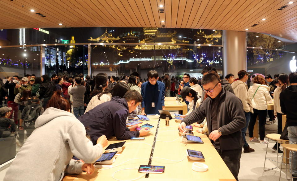 Customers are shopping at Asia's largest Apple flagship store in Shanghai, China, on March 23, 2024. (Photo by Costfoto/NurPhoto via Getty Images)