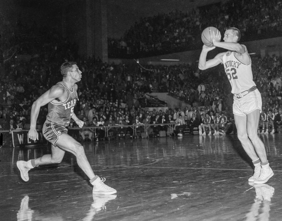 Kentucky guard Vernon Hatton made a 47-foot shot with one second left in the first overtime to tie Temple 71-71 as the Owls’ Guy Rodgers, left, was too late to block the shot. The Wildcats defeated the Owls 85-83 in triple overtime in Memorial Coliseum on Dec. 7, 1957.