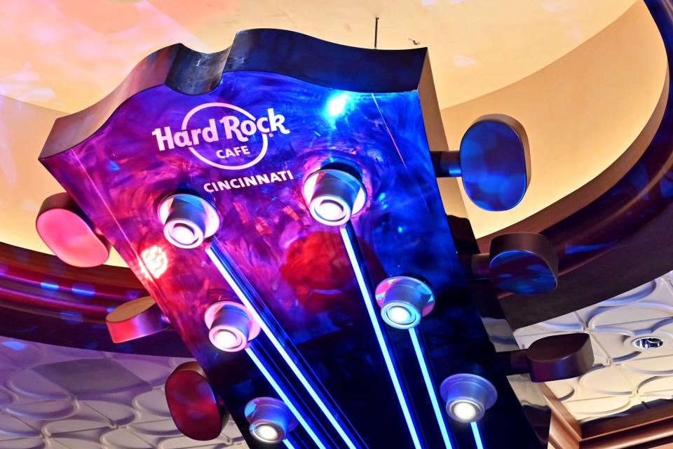 A sculpture of a guitar hangs at the front of the Hard Rock Cafe during its official opening July 15 inside the Hard Rock Casino Cincinnati.