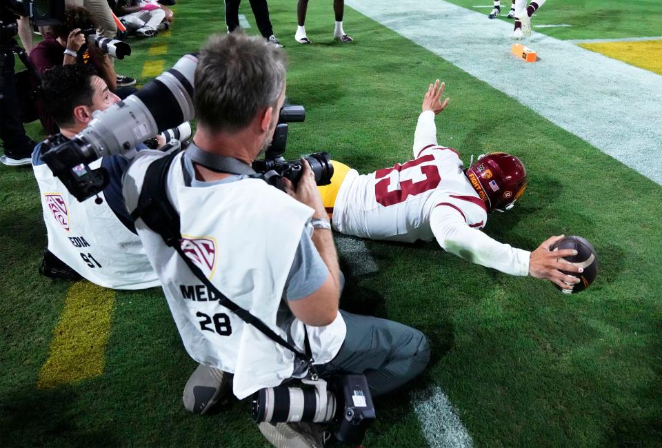 Sep 23, 2023; Tempe, Arizona, USA; USC Trojans quarterback Caleb Williams (13) reacts after scoring a touchdown against the Arizona State Sun Devils in the first half at Mountain America Stadium. Mandatory Credit: Rob Schumacher-Arizona Republic