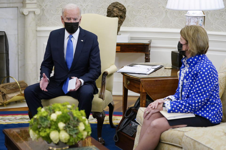 FILE - In this May 13, 2021, file photo, Sen. Shelley Moore Capito, R-W.Va., right, listens as President Joe Biden speaks during a meeting with Republican Senators in the Oval Office of the White House in Washington. The two senators from West Virginia are playing central roles in Biden's infrastructure plans. Democrat Joe Manchin is a crucial 50th vote for his party on Biden's proposals. (AP Photo/Evan Vucci)