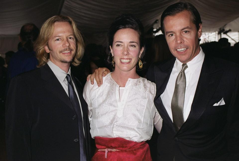 Kate Spade is flanked by her husband, Andy Spade (right) and brother-in-law David Spade at the American Fashion Awards in New York in 2000. (New York Daily News Archive via Getty Images)