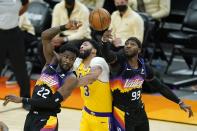 Phoenix Suns center Deandre Ayton (22) and Suns forward Jae Crowder (99) battle with Los Angeles Lakers forward Anthony Davis (3) for the ball during the first half of Game 2 of their NBA basketball first-round playoff series Tuesday, May 25, 2021, in Phoenix. (AP Photo/Ross D. Franklin)