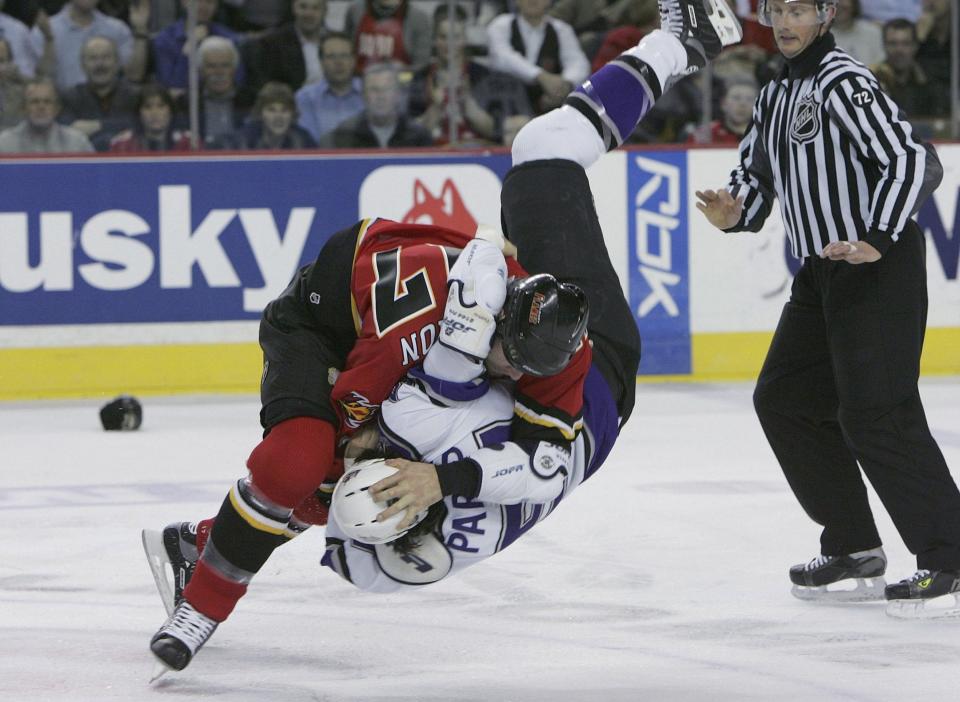 Mason flips over George Parros of the LA Kings during a fight in 2006