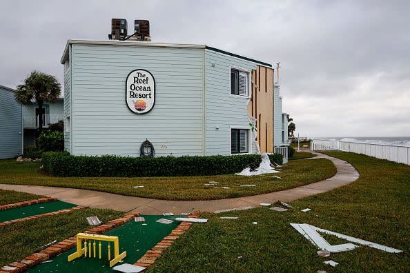 A view of a partially damaged wall at The Reef Ocean Resort in Vero Beach, Florida, on November 10, 2022. - Tropical Storm Nicole slowed after making landfall in the US state of Florida, meteorologists said Thursday, with high winds raising concerns that a long-delayed NASA rocket launch could be disrupted. (Photo by Eva Marie UZCATEGUI / AFP) (Photo by EVA MARIE UZCATEGUI/AFP via Getty Images)