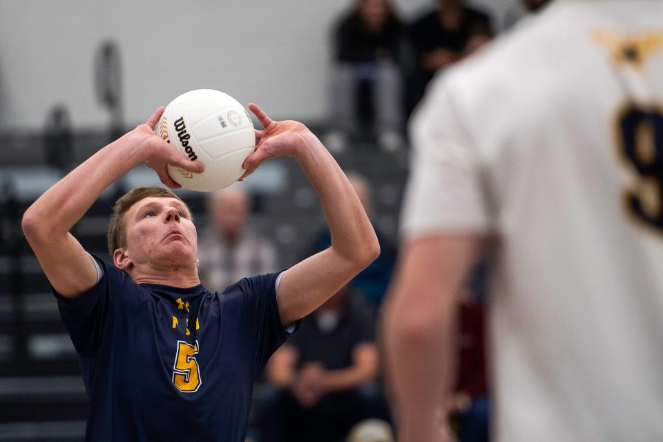 Poudre School District's Shane Gerdes sets the ball during a game against Thornton on Tuesday, March 26, 2024 at Fossil Ridge High School in Fort Collins, Colo.