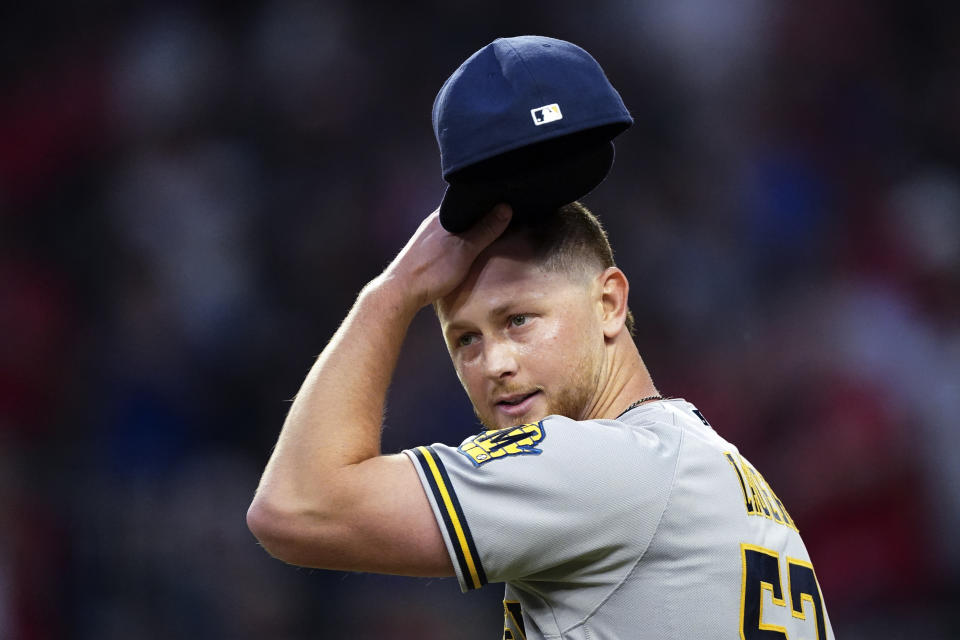 Milwaukee Brewers starting pitcher Eric Lauer pauses during the fourth inning of the team's baseball game against the Atlanta Braves on Friday, May 6, 2022, in Atlanta. (AP Photo/John Bazemore)