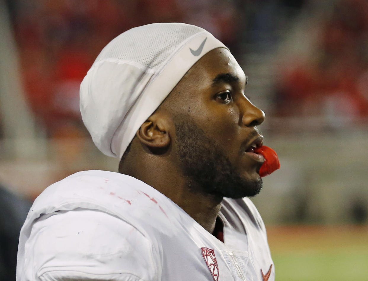 Stanford running back Bryce Love (20) watches from the sidelines in the first half during an NCAA college football game against Utah Saturday, Oct. 7, 2017, in Salt Lake City. (AP Photo/Rick Bowmer)