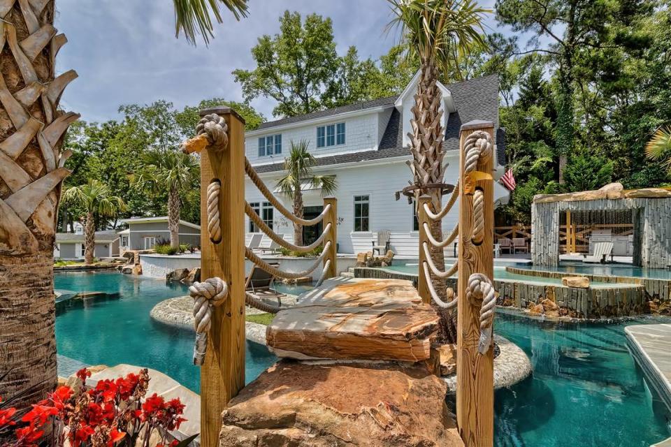An image of a bridge that crosses part of the custom pool at a $3.4 million luxury home for sale by Lake Murray.