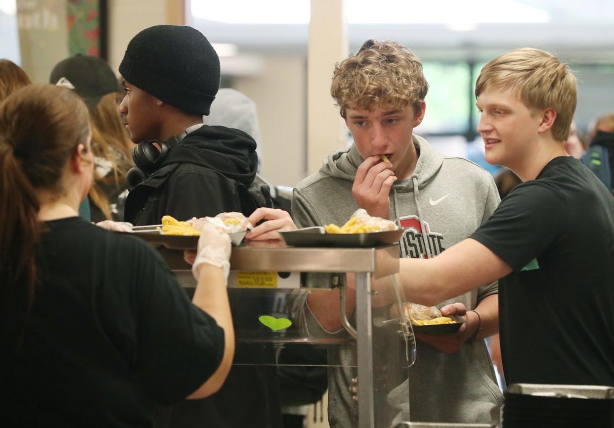 John Shubert and Justin Nadiak, both ninth graders, get lunch at Nordonia High School on Thursday.