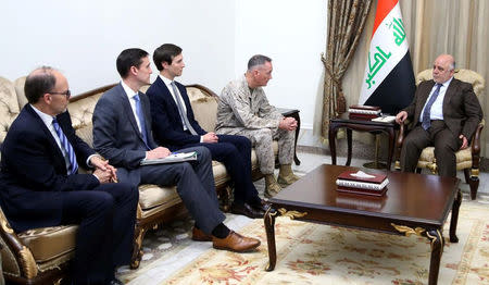 Iraqi Prime Minister Haider al-Abadi (R), welcomes Marine Corps Gen. Joseph F. Dunford Jr., chairman of the Joint Chiefs of Staff (2nd R), and U.S. President Donald Trump's son-in-law and senior advisor Jared Kushner (3rd L) in Baghdad, Iraq April 3, 2017. Iraqi Prime Minister Office/Handout via REUTERS