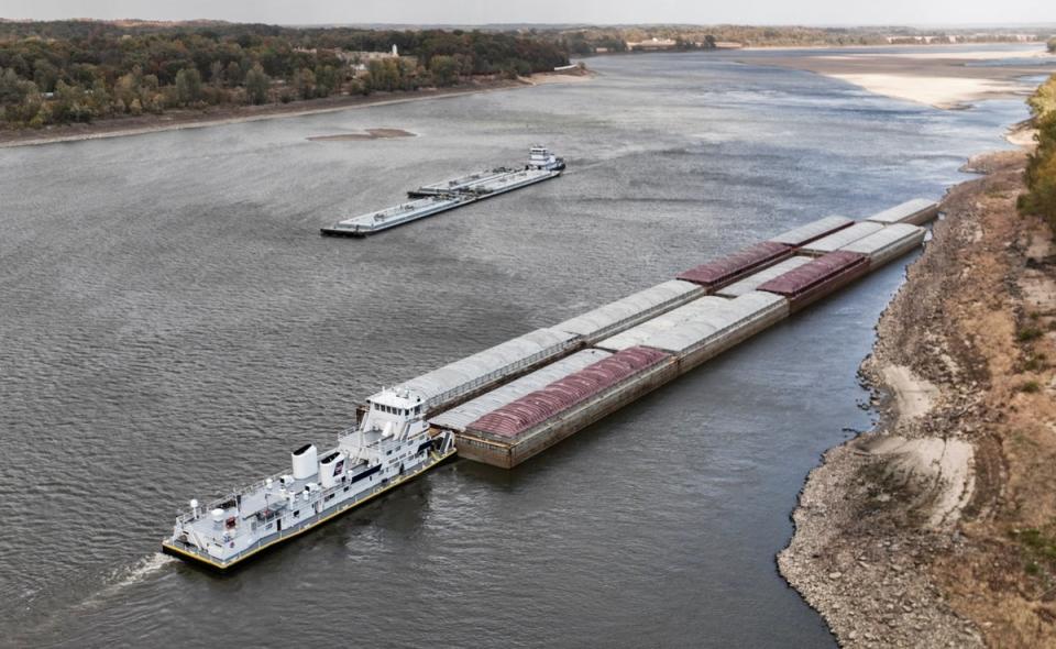 A boat waits for another to pass in a narrow stretch of the Mississippi River in Missouri on Sunday (EPA)