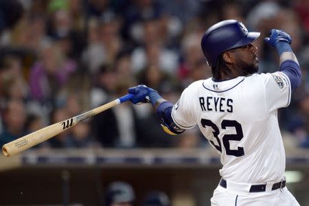 Apr 23, 2019; San Diego, CA, USA; San Diego Padres right fielder Franmil Reyes (32) hits a solo home run during the sixth inning against the Seattle Mariners at Petco Park. Mandatory Credit: Jake Roth-USA TODAY Sports