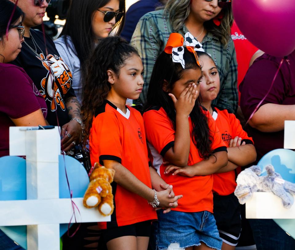 Mourners pay their respects on May 27 at a memorial for the 23 people killed at Robb Elementary School in Uvalde, Texas, on May 24.