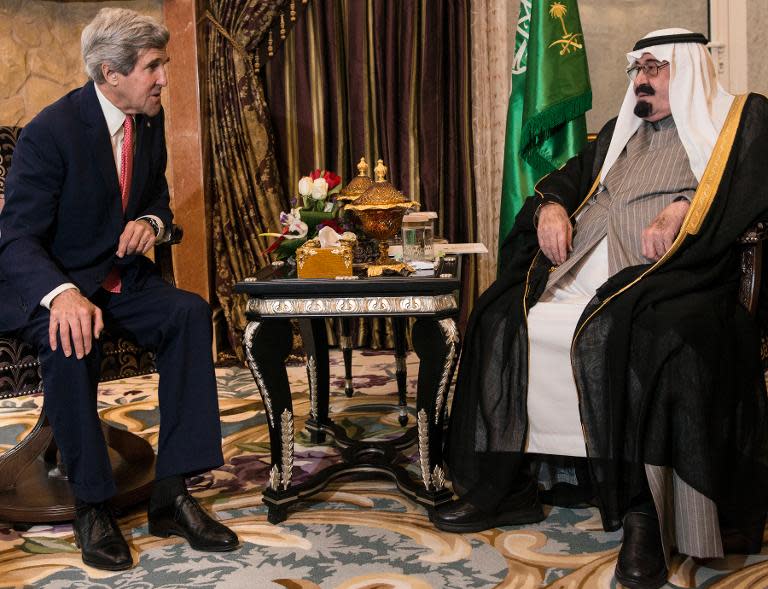 US Secretary of State John Kerry (L) and Saudi Arabia's King Abdullah talk before a meeting at the king's desert encampment on January 5, 2014 in Rawdat al-Khuraim