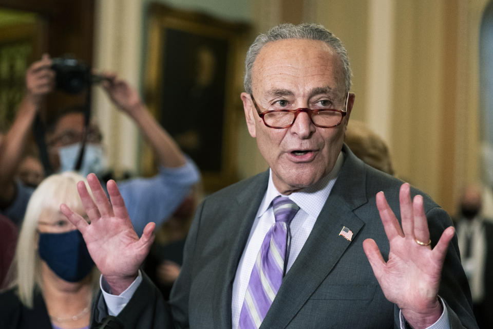 Senate Majority Leader Chuck Schumer of N.Y., together with other Democratic Party leaders speaks to reporters on Capitol Hill in Washington, Tuesday, Oct. 5, 2021. (AP Photo/Manuel Balce Ceneta)