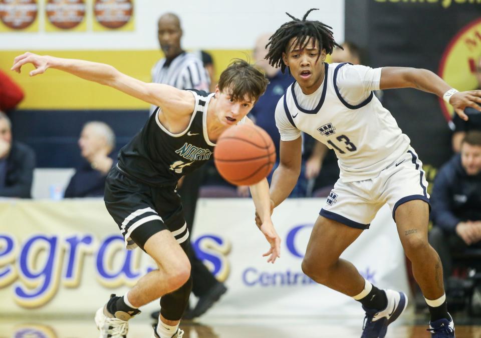 Warren Central's Omari Glover pressures North Oldham's Luke Anderson in the first half in Monday's semifinal King of the Bluegrass in Fairdale. Dec. 19, 2022 