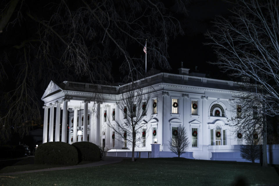 White House lit against the night sky