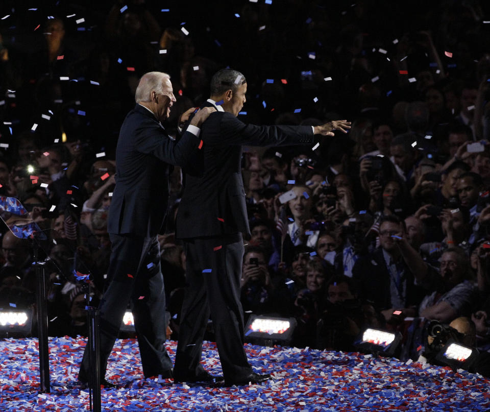 President Barack Obama and Vice President Joe Biden acknowledge the crowd at his election night party Wednesday, Nov. 7, 2012, in Chicago. President Obama defeated Republican challenger former Massachusetts Gov. Mitt Romney. (AP Photo/Nam Y. Huh)