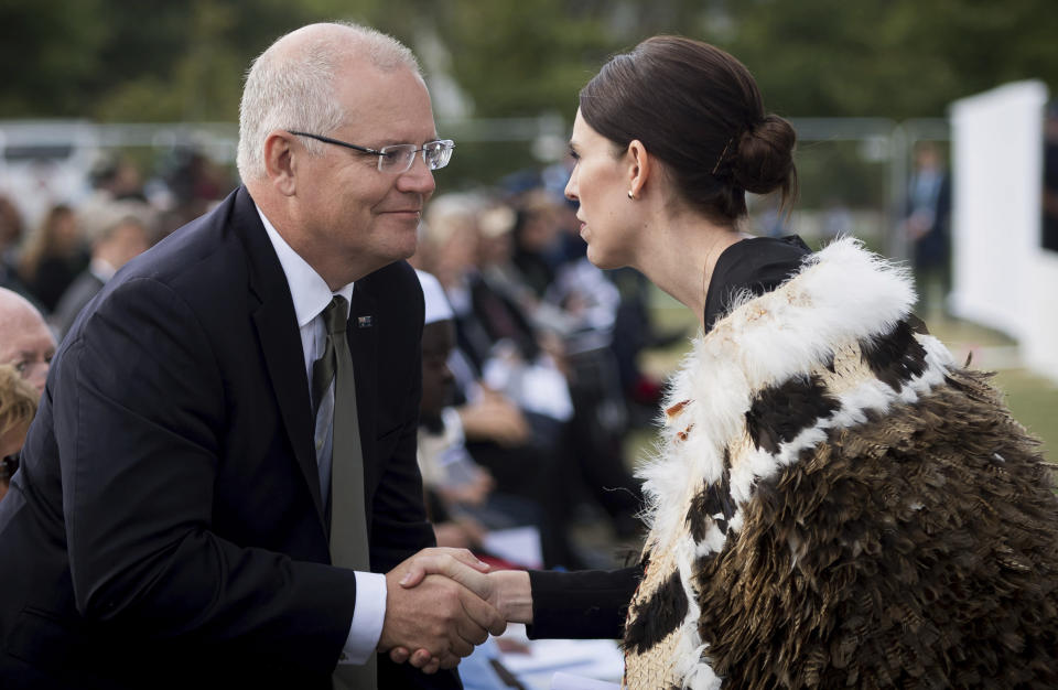 In this photo supplied by the New Zealand government, New Zealand Prime Minister Jacinda Ardern, right, meets Australian Prime Minister Scott Morrison during the national remembrance service for the victims of the March 15 mosques terrorist attack in Hagley Park, Christchurch, New Zealand, Friday, March 29, 2019. (Mark Tantrum/New Zealand Government via AP)
