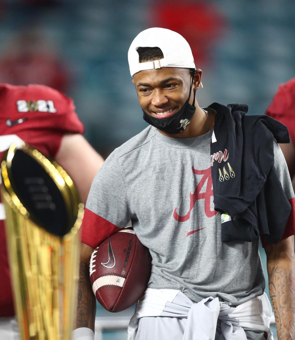 Alabama receiver DeVonta Smith celebrates after defeating Ohio State in the College Football Playoff National Championship Game, Jan. 11, 2021 in Miami Gardens, Fla.