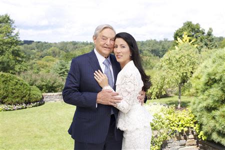 George Soros and Tamiko Bolton are shown as they prepare to attend the reception at Museum of Modern Art (MOMA) in this handout photo released on September 20, 2013. Soros, the 83-year-old billionaire investor, philanthropist and active supporter of liberal political causes, is set to marry health care and education consultant Bolton on Saturday at his estate near New York City. REUTERS/Julie Skarratt Photography/Handout via Reuters