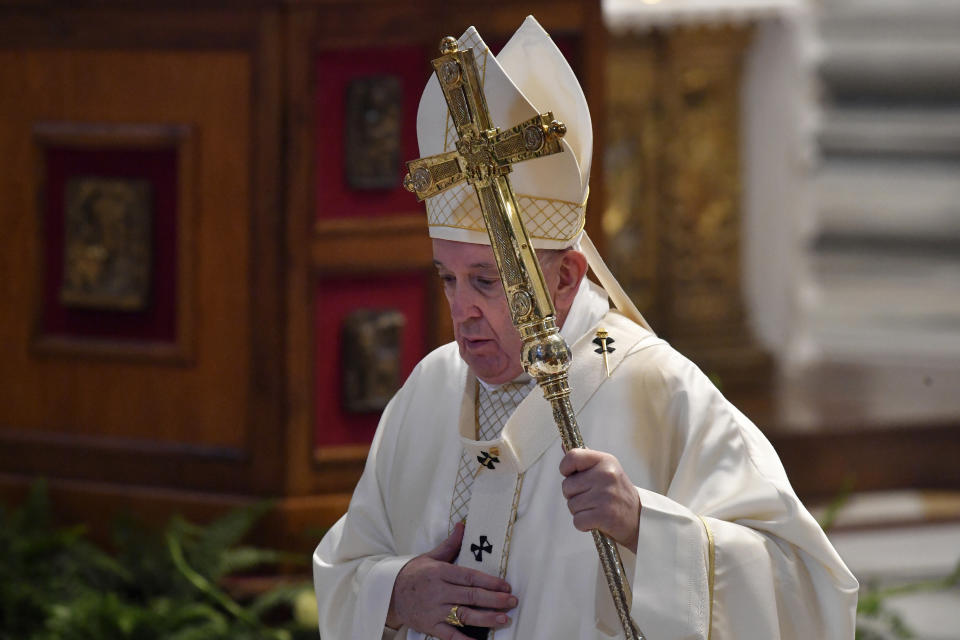 Pope Francis leaves after celebrating a Corpus Domini Mass, inside St. Peter's Basilica at the Vatican Sunday, June 14, 2020. (Tiziana Fabi/Pool Photo via AP)