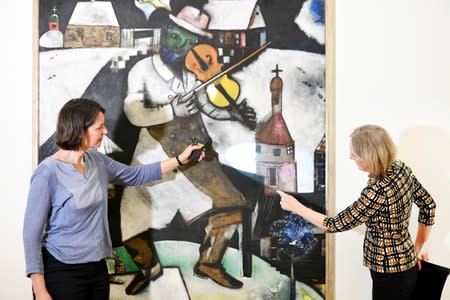 Conservators Meta Chavannes and Madeleine Bisschoff speak about a study on a collection of Marc Chagall's artwork in the conservation atelier of the Stedelijk Museum in Amsterdam