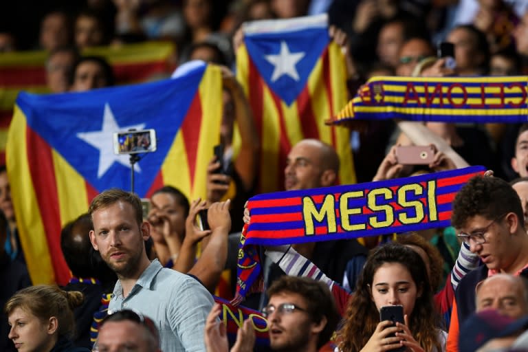 Barcelona supporters hold Catalan pro-independence Estelada flags during their match against Malaga CF in Barcelona on October 21, 2017