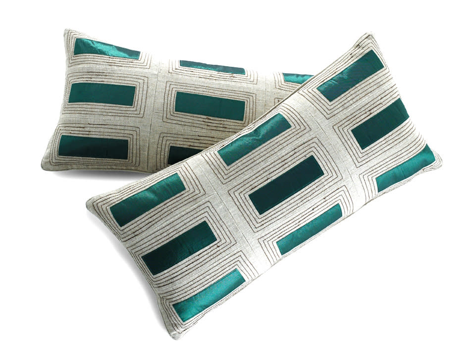 This undated publicity image provided by HomeGoods shows emerald pillows. If you’re uncertain about going big with this season’s new emerald green, consider throw pillows like these, with just a sliver of the color (www.homegoods.com ).(AP Photo/HomeGoods)