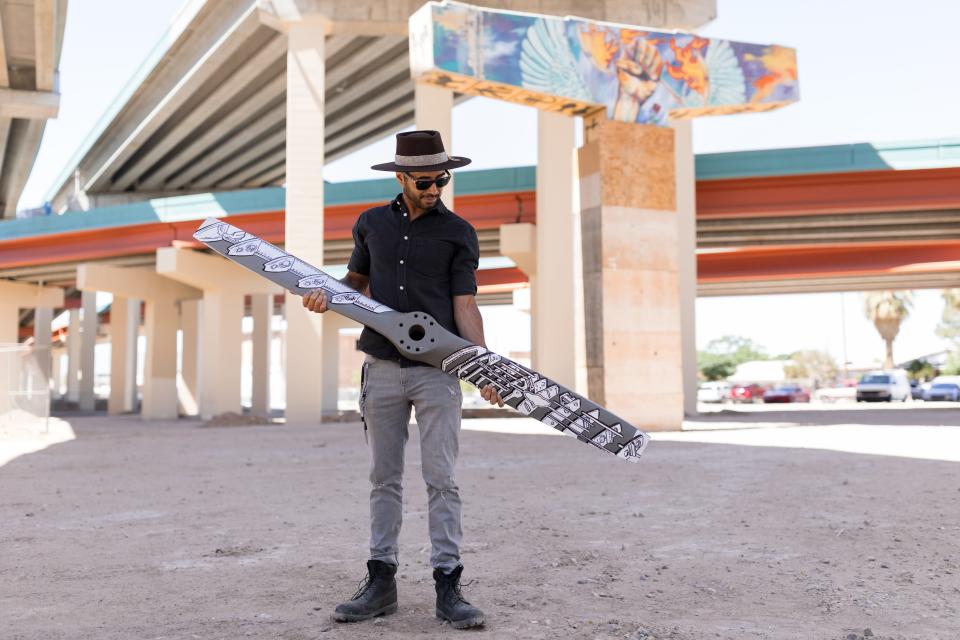 Galeria Lincoln owner and El Paso muralist Tino Ortega holds a propeller that he painted for the 2022 Art Gala and Auction, a fundraiser to replace murals at Lincoln Park torn down for construction. Ortega stands at Lincoln Park in South-Central El Paso on Thursday.