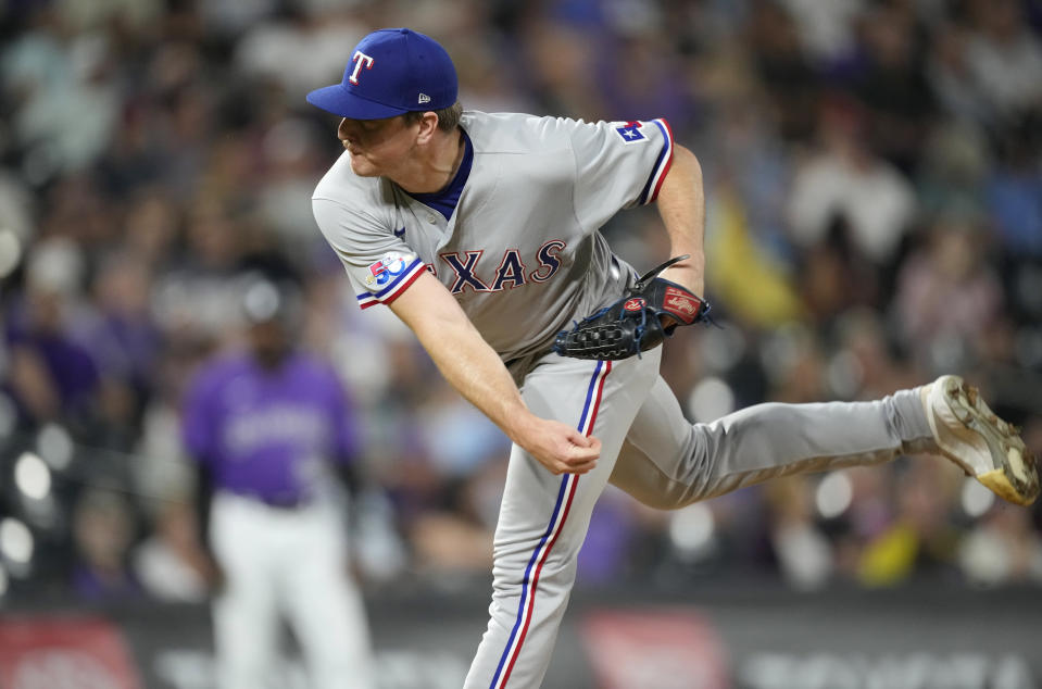 Texas Rangers relief pitcher Josh Sborz works against the Colorado Rockies in the sixth inning of a baseball game Tuesday, Aug. 23, 2022, in Denver. (AP Photo/David Zalubowski)
