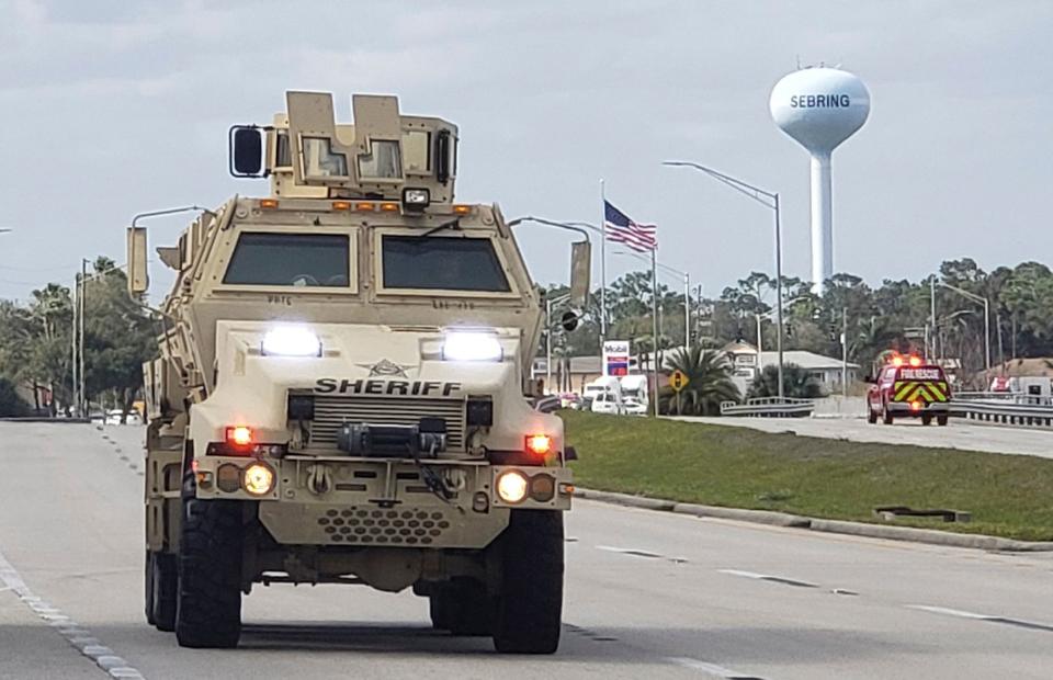 A sheriff's department armored vehicle arrives at a SunTrust Bank branch on Jan. 23, 2019, in Sebring, Fla.