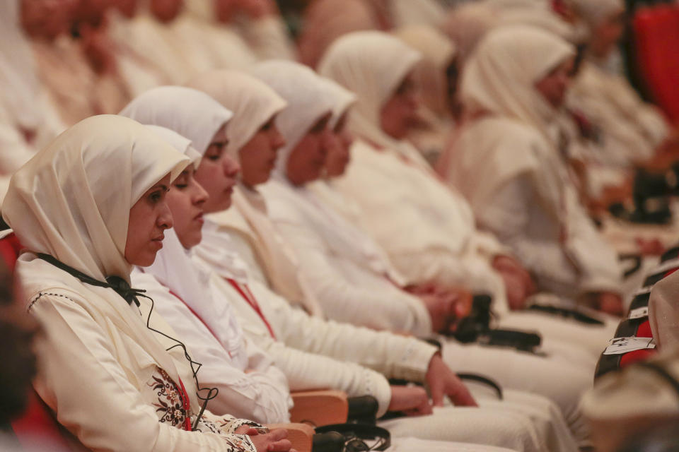 Religious students listen to a speech by Pope Francis and King Mohamed VI, at the Mohammed VI Institute, a school of learning for imams, in Rabat, Morocco, Saturday, March 30, 2019. Francis's weekend trip to Morocco aims to highlight the North African nation's tradition of Christian-Muslim ties while also letting him show solidarity with migrants at Europe's door and tend to a tiny Catholic flock on the peripheries. (AP Photo/Mosa'ab Elshamy)