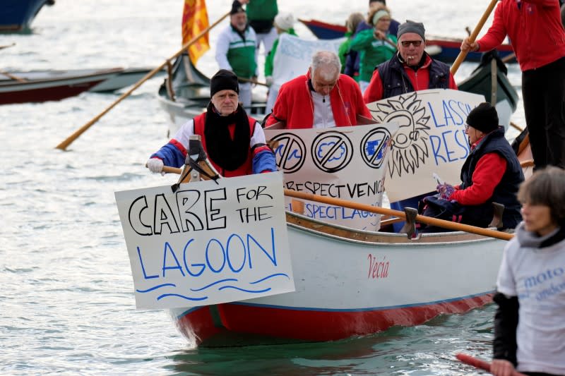 Scores of boats take to the Saint Mark's Basin, as Venetians protest against the damage caused by big ships, in Venice