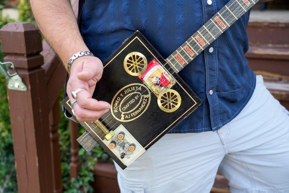 Devin and Luna Cherry have matching Romeo and Juliet cigar box guitars.