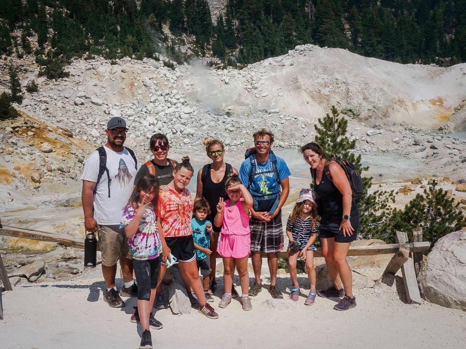 Katie with other adults and children at Bumpass Hell in rocky outdoor area