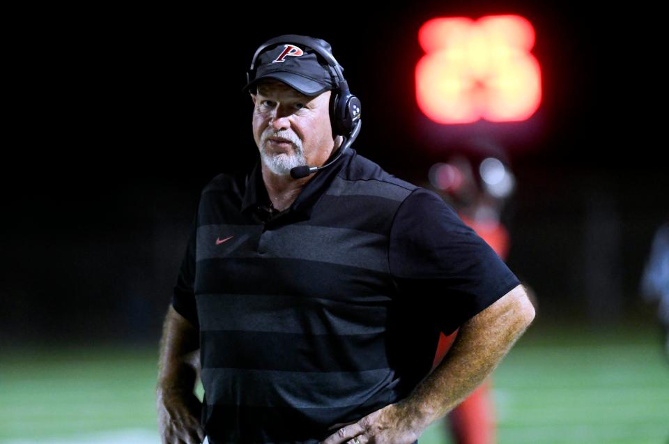 Palm Bay football head coach Dan Burke watches the action during Friday's game.