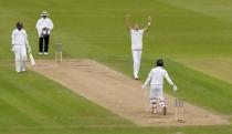 England's Stuart Broad takes the wicket of Sri Lanka's Dinesh Chandimal Action Images via Reuters / Jason Cairnduff