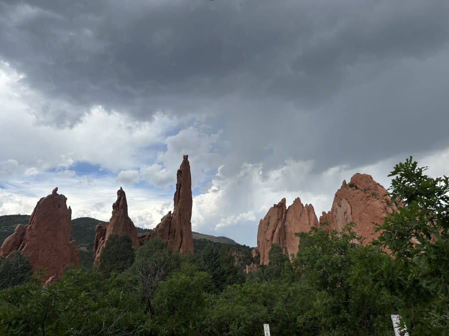 Red rocks at Garden of the Gods with storm clouds seen on June 8, 2024. (Brooke Williams)