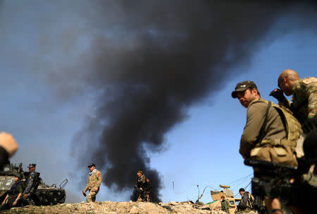 Iraqi security forces member are pictured during a battle with Islamic State's militants West Mosul, Iraq. REUTERS/Zohra Bensemra