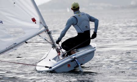 Brazilian Olympic team sailor Robert Scheidt sails his laser yacht during a training session in Rio de Janeiro, Brazil, June 22, 2016. REUTERS/Sergio Moraes
