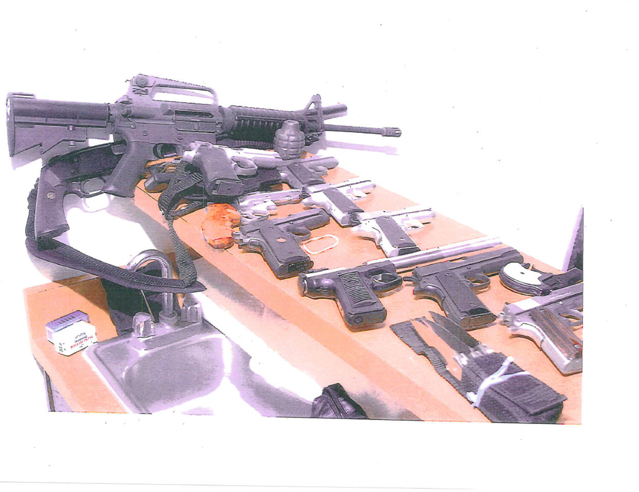 Various weapons seized from Bulger's apartment in Santa Monica, California, in July 2011. Two years later, he was convicted on multiple of charges, including complicity in 11 killings. 