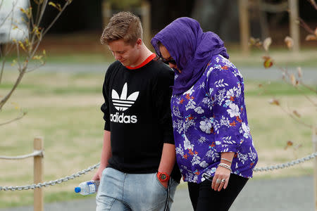 People attend the burial ceremony of a victim of the mosque attacks, at the Memorial Park Cemetery in Christchurch, New Zealand March 21, 2019. REUTERS/Edgar Su