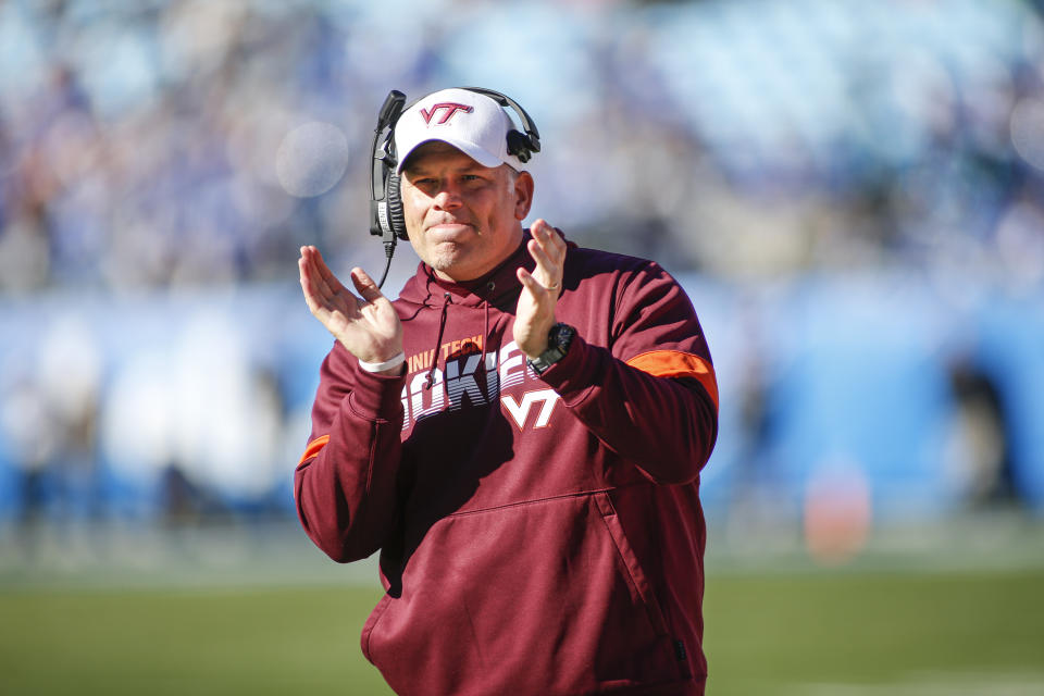 Virginia Tech head coach Justin Fuente celebrates after his team scored against Kentucky in the first half of the Belk Bowl NCAA college football game in Charlotte, N.C., Tuesday, Dec. 31, 2019. (AP Photo/Nell Redmond)