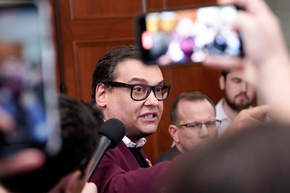 Rep. George Santos, R-N.Y., talks to reporters as House Republicans hold a caucus meeting at the Capitol in Washington, Friday, Oct. 13, 2023.